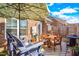 Cozy outdoor patio with umbrella-covered seating area, ideal for relaxing and entertaining guests at 1126 Talisker Way, Burlington, NC 27215