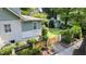 Backyard view features a well-manicured lawn, detached shed, and gated entrance, offering a private outdoor space at 1200 Glenwood Ave, Raleigh, NC 27605