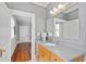 Well-lit bathroom with modern fixtures and a classic vanity at 1200 Glenwood Ave, Raleigh, NC 27605