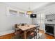 Breakfast nook featuring built in wine rack, hardwood table, and decorative stained glass windows at 1200 Glenwood Ave, Raleigh, NC 27605