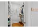 Spacious walk-in closet with built-in shelving and hanging space at 1200 Glenwood Ave, Raleigh, NC 27605
