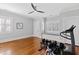 Exercise room with hardwood floors, built in window seat, ceiling fan, and workout equipment at 1200 Glenwood Ave, Raleigh, NC 27605