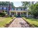 Inviting home exterior with a brick walkway and covered front porch at 1200 Glenwood Ave, Raleigh, NC 27605