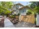 Beautiful two-story home featuring a fenced yard and lush greenery at 1200 Glenwood Ave, Raleigh, NC 27605