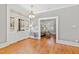 Inviting foyer featuring hardwood floors and a view into the adjacent living area at 1200 Glenwood Ave, Raleigh, NC 27605