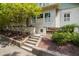 Charming brick home entrance with well-manicured landscaping and walkway at 1200 Glenwood Ave, Raleigh, NC 27605