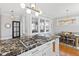 Charming kitchen with granite countertops, gas range, and breakfast nook with natural light at 1200 Glenwood Ave, Raleigh, NC 27605