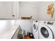 Well-equipped laundry room with modern washer and dryer units at 1200 Glenwood Ave, Raleigh, NC 27605