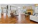 Bright living room featuring hardwood floors, a fireplace, and stylish decor at 1200 Glenwood Ave, Raleigh, NC 27605