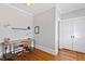 Bright office featuring hardwood floors, a simple desk setup, and neutral wall paint at 1200 Glenwood Ave, Raleigh, NC 27605