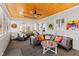 Bright sun room with wood ceiling, brick walls, comfortable seating, and lots of natural light at 1200 Glenwood Ave, Raleigh, NC 27605