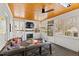 Cozy sunroom featuring a fireplace, mounted tv, and lots of natural light at 1200 Glenwood Ave, Raleigh, NC 27605