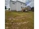 Backyard featuring a newly-constructed home and a wooden deck at 122 Reece Dr, Sanford, NC 27332