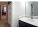 Bright bathroom with white vanity, tile backsplash, and walk-in shower at 1520 Village Grove Ct, Hillsborough, NC 27278