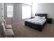 Cozy bedroom with a comfortable bed, side tables and carpet flooring at 1520 Village Grove Ct, Hillsborough, NC 27278