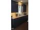 The kitchen boasts dark cabinets, granite countertops, stainless steel appliances, and a tiled backsplash at 1520 Village Grove Ct, Hillsborough, NC 27278