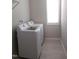 Laundry room with white washer and dryer next to a window at 1520 Village Grove Ct, Hillsborough, NC 27278