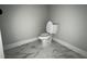 Clean bathroom featuring modern toilet and tile flooring at 165 Cotton Fields Ln # 25, Fuquay Varina, NC 27526