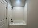 Cozy bathroom with white subway tile shower, matte black shower head, and white shower tub at 165 Cotton Fields Ln # 25, Fuquay Varina, NC 27526