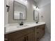 Modern bathroom with double vanity, stylish mirrors, and sleek black fixtures at 165 Cotton Fields Ln # 25, Fuquay Varina, NC 27526