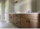 Bathroom vanity with double sinks, quartz countertop, and modern black fixtures at 165 Cotton Fields Ln # 25, Fuquay Varina, NC 27526