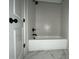 Bright bathroom with a white subway tiled shower and marble floors at 165 Cotton Fields Ln # 25, Fuquay Varina, NC 27526