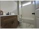 Bathroom featuring a shower-tub combo with white subway tile and modern black fixtures at 165 Cotton Fields Ln # 25, Fuquay Varina, NC 27526