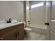 Bathroom with updated tile flooring, sink and shower over tub at 165 Cotton Fields Ln # 25, Fuquay Varina, NC 27526