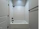 Clean bathroom featuring a tub with white subway tile and black hardware at 165 Cotton Fields Ln # 25, Fuquay Varina, NC 27526