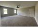 Spacious bedroom with neutral walls, cozy carpeting, and a ceiling fan at 165 Cotton Fields Ln # 25, Fuquay Varina, NC 27526