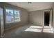 The new bedroom has light-colored walls, a large window, and a walk-in closet at 165 Cotton Fields Ln # 25, Fuquay Varina, NC 27526