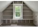 Spacious bedroom featuring built in shelves and a large window for ample natural light at 165 Cotton Fields Ln # 25, Fuquay Varina, NC 27526