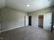 Spacious bedroom featuring neutral walls, plush carpet, and a closet for ample storage at 165 Cotton Fields Ln # 25, Fuquay Varina, NC 27526