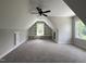 Spacious bedroom featuring carpet flooring, built in shelves and a large window for ample natural light at 165 Cotton Fields Ln # 25, Fuquay Varina, NC 27526