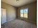 Bedroom featuring a window with views and light hardwood floors at 165 Cotton Fields Ln # 25, Fuquay Varina, NC 27526