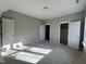 A newly built bedroom with doors, fresh paint, and great light at 165 Cotton Fields Ln # 25, Fuquay Varina, NC 27526