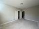 Bedroom with a closet and doorways, offering flexibility for personal style at 165 Cotton Fields Ln # 25, Fuquay Varina, NC 27526