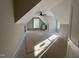 An unfinished bedroom features built in shelving, large windows, and a ceiling fan at 165 Cotton Fields Ln # 25, Fuquay Varina, NC 27526