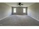Spacious bedroom with neutral walls, cozy carpeting, and a ceiling fan at 165 Cotton Fields Ln # 25, Fuquay Varina, NC 27526