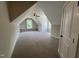 This bonus room has carpeted floors and built-in shelving that surrounds a window at 165 Cotton Fields Ln # 25, Fuquay Varina, NC 27526