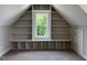 This bonus room has carpeted floors and built-in shelving that surrounds a window at 165 Cotton Fields Ln # 25, Fuquay Varina, NC 27526