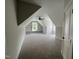 Bright bonus room with built-in shelving and dormer windows at 165 Cotton Fields Ln # 25, Fuquay Varina, NC 27526