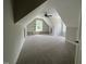 Bonus room with carpeted floor, built-in shelving, and ceiling fan at 165 Cotton Fields Ln # 25, Fuquay Varina, NC 27526