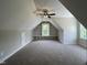 This bonus room has carpeted floors, dormers, and a ceiling fan for added comfort at 165 Cotton Fields Ln # 25, Fuquay Varina, NC 27526