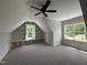 Spacious bonus room with recessed lighting, ceiling fan and built-in shelving at 165 Cotton Fields Ln # 25, Fuquay Varina, NC 27526
