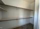 White closet with built-in shelves, wooden rods, and plenty of storage space at 165 Cotton Fields Ln # 25, Fuquay Varina, NC 27526