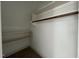 Closet with wooden rod and white shelving at 165 Cotton Fields Ln # 25, Fuquay Varina, NC 27526