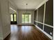 Inviting dining space featuring hardwood floors, natural light, and decorative wainscoting at 165 Cotton Fields Ln # 25, Fuquay Varina, NC 27526