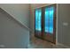 Light and bright foyer featuring hardwood floors and a glass paned front door at 165 Cotton Fields Ln # 25, Fuquay Varina, NC 27526