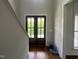 Stylish front entry with a stained wood double door, and bright lighting, creating an inviting atmosphere at 165 Cotton Fields Ln # 25, Fuquay Varina, NC 27526